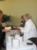 Guests receive their coupon brochures and tasting plates